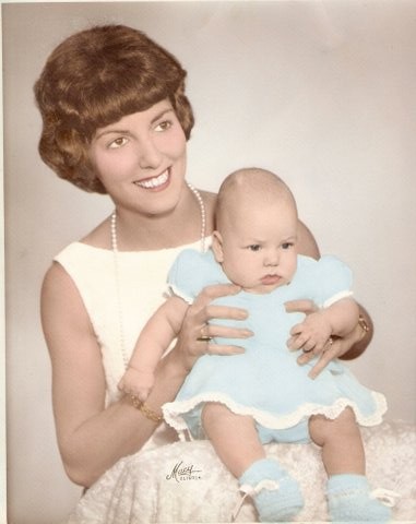 Mom, with either me or my sister (all baldys look alike)